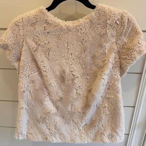 Anthropology faux fur top.  Zipper on back.   Small